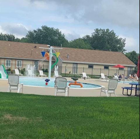 79 S Pointe Cir S Unit 79, Coram, NY 11727 - community pool featuring a patio area and a water slide