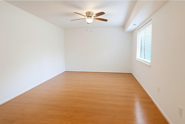 79 S Pointe Cir S Unit 79, Coram, NY 11727 - spare room featuring ceiling fan, light wood-style flooring, and baseboards