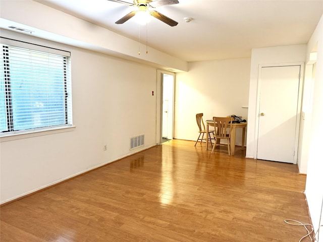 79 S Pointe Cir S Unit 79, Coram, NY 11727 - unfurnished room featuring wood finished floors, a ceiling fan, and a smoke detector