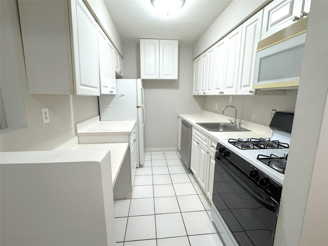 79 S Pointe Cir S Unit 79, Coram, NY 11727 - kitchen featuring white appliances, a sink, white cabinets, and light tile patterned floors