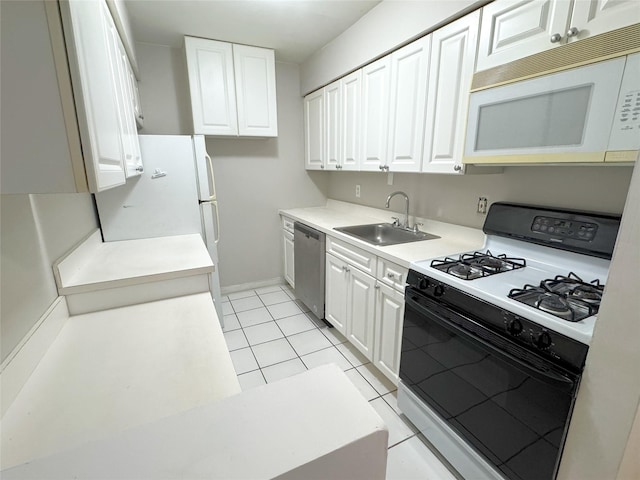 79 S Pointe Cir S Unit 79, Coram, NY 11727 - kitchen with gas stove, white microwave, stainless steel dishwasher, a sink, and white cabinetry