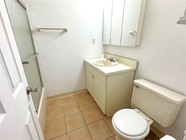 79 S Pointe Cir S Unit 79, Coram, NY 11727 - bathroom with toilet, vanity, tile patterned flooring, baseboards, and shower / bath combination