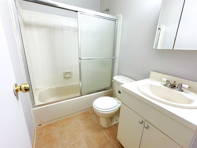 79 S Pointe Cir S Unit 79, Coram, NY 11727 - full bath featuring vanity, toilet, combined bath / shower with glass door, and tile patterned floors