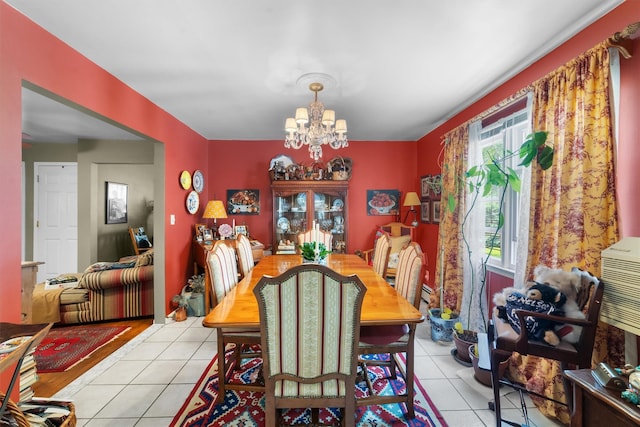 336 Mile Square Rd, Yonkers, NY 10701 - dining room with light tile patterned floors and a chandelier