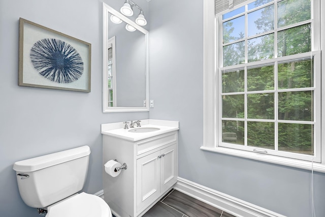 27 Olmsted Rd, Scarsdale, NY 10583 - bathroom featuring toilet, vanity, and baseboards