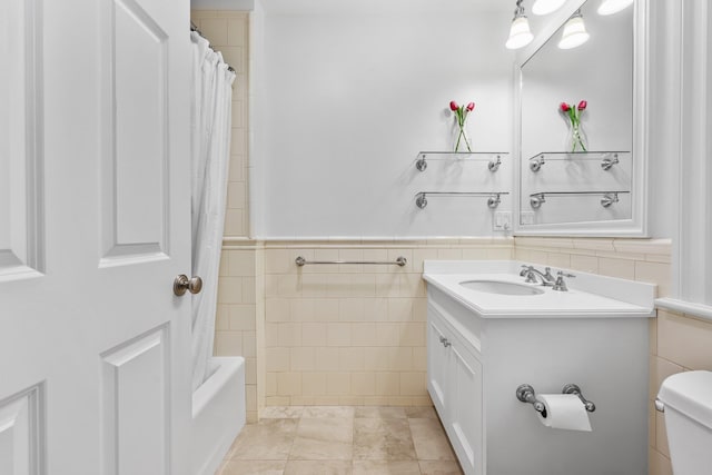 27 Olmsted Rd, Scarsdale, NY 10583 - full bath featuring tile walls, vanity, toilet, a wainscoted wall, and shower / tub combo