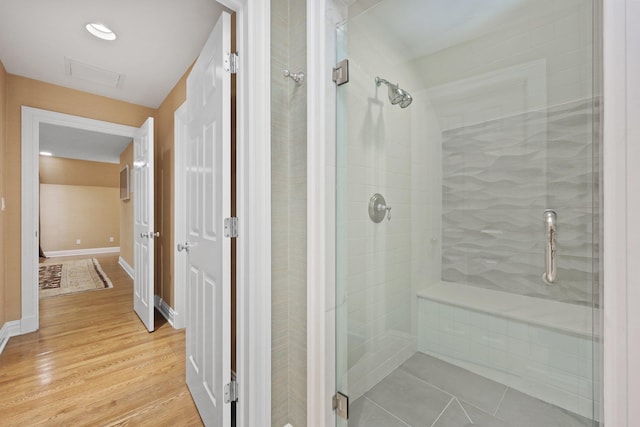 27 Olmsted Rd, Scarsdale, NY 10583 - bathroom with a stall shower and wood finished floors