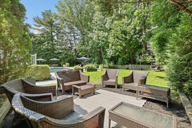 27 Olmsted Rd, Scarsdale, NY 10583 - view of patio with outdoor lounge area, an outdoor pool, a wooden deck, and view of scattered trees