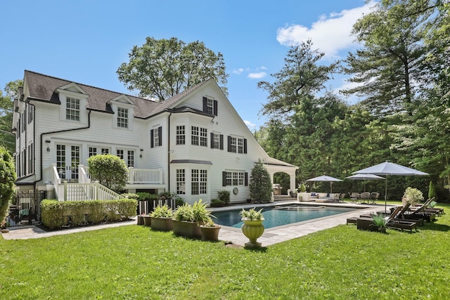 27 Olmsted Rd, Scarsdale, NY 10583 - rear view of house featuring french doors, a yard, an outdoor pool, roof with shingles, and a patio