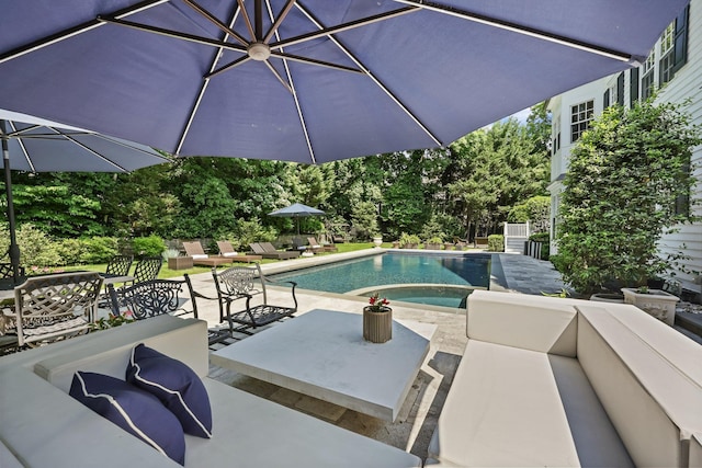 27 Olmsted Rd, Scarsdale, NY 10583 - view of swimming pool featuring a patio area, an outdoor living space, and a pool with connected hot tub