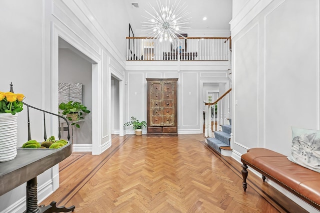27 Olmsted Rd, Scarsdale, NY 10583 - foyer featuring a chandelier, stairs, a decorative wall, baseboards, and recessed lighting