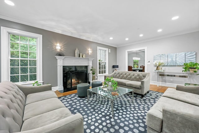 27 Olmsted Rd, Scarsdale, NY 10583 - living room with light wood finished floors, plenty of natural light, recessed lighting, a fireplace, and ornamental molding