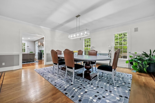 27 Olmsted Rd, Scarsdale, NY 10583 - dining room with crown molding, healthy amount of natural light, wood finished floors, and a chandelier