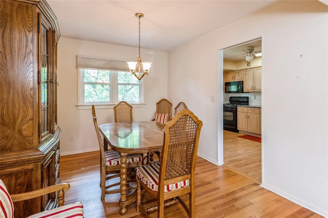 4 Roland Ct, Nanuet, NY 10954 - dining area with light wood-style flooring and a chandelier
