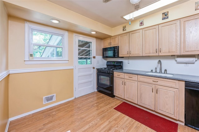 4 Roland Ct, Nanuet, NY 10954 - kitchen with black appliances, light brown cabinetry, dark countertops, light wood-style flooring, and recessed lighting