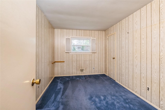 4 Roland Ct, Nanuet, NY 10954 - carpeted empty room featuring baseboards and wooden walls