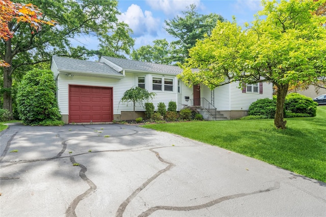 4 Roland Ct, Nanuet, NY 10954 - ranch-style house with an attached garage, driveway, a front yard, and roof with shingles