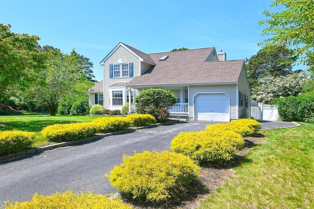 8 Thunder Rd, Miller Place, NY 11764 - view of front of property featuring an attached garage, asphalt driveway, a chimney, and a shingled roof