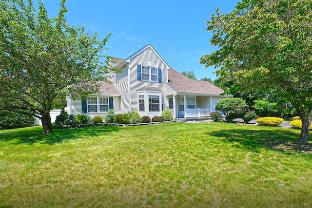 8 Thunder Rd, Miller Place, NY 11764 - traditional-style house with covered porch and a front yard