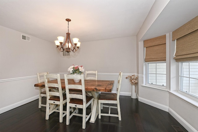 8 Thunder Rd, Miller Place, NY 11764 - dining room featuring baseboards, a chandelier, and hardwood / wood-style floors