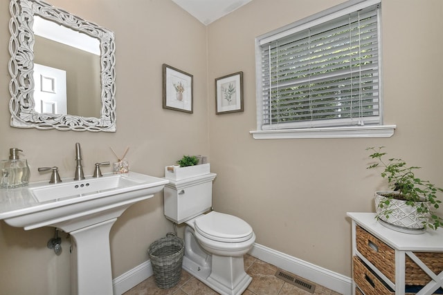 8 Thunder Rd, Miller Place, NY 11764 - bathroom featuring toilet, baseboards, tile patterned floors, and a sink
