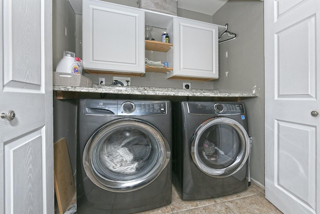 8 Thunder Rd, Miller Place, NY 11764 - laundry room with cabinet space, washer and clothes dryer, baseboards, and light tile patterned floors