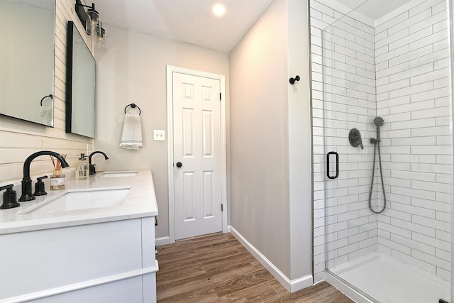 8 Thunder Rd, Miller Place, NY 11764 - bathroom featuring double vanity, wood finished floors, a stall shower, and baseboards