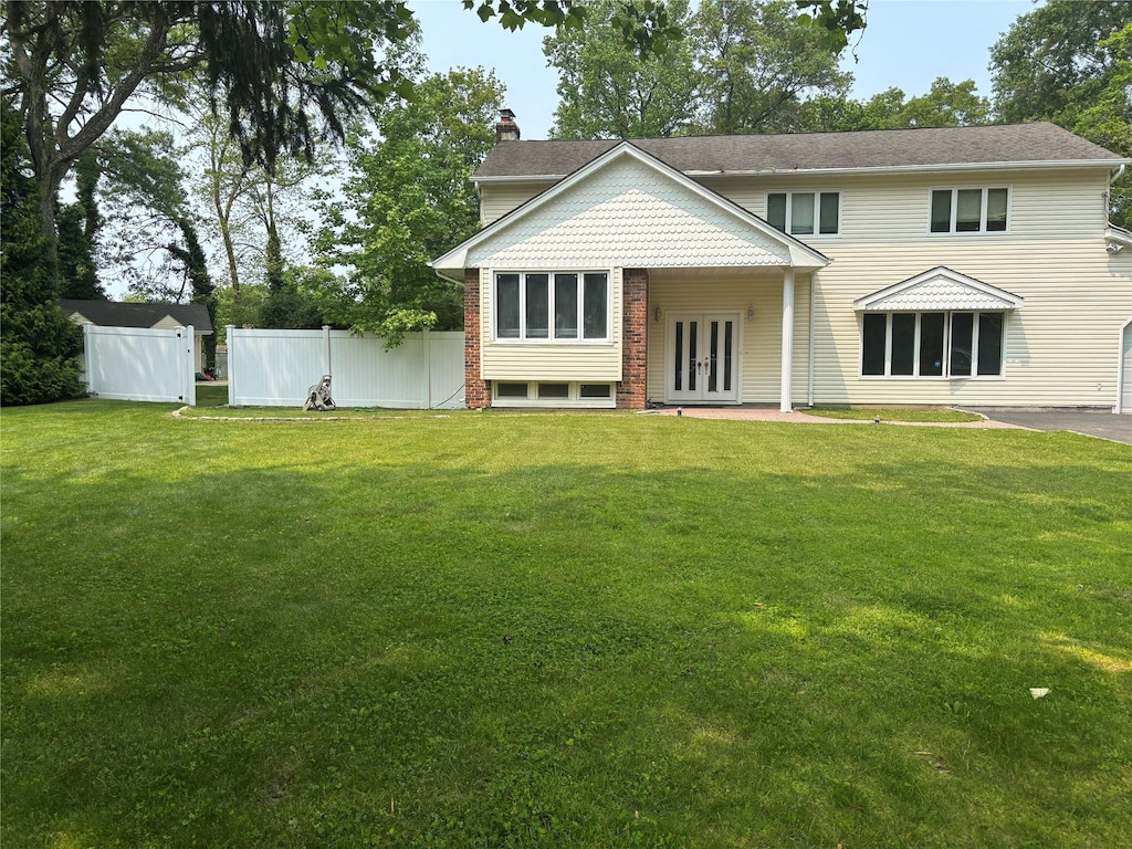 6 Attridge Ct, Melville, NY 11747 - view of front of home featuring french doors and a chimney