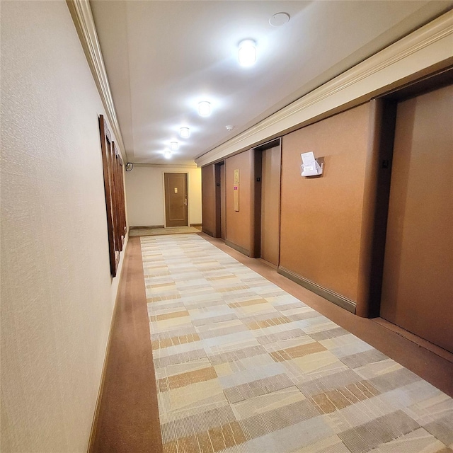 70-20 108th St Unit 4C, Forest Hills, NY 11375 - hall featuring elevator, light carpet, and baseboards