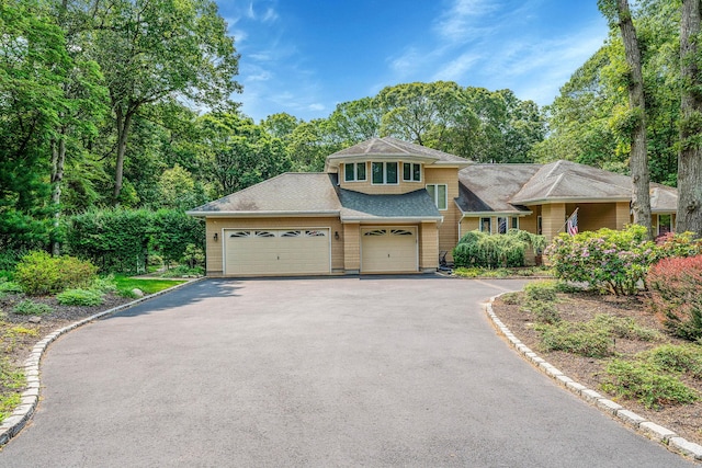6 Ring Neck Ct, Wading River, NY 11792 - view of front facade with asphalt driveway, an attached garage, and a shingled roof