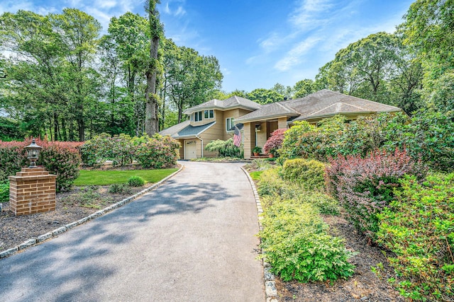 6 Ring Neck Ct, Wading River, NY 11792 - tri-level home featuring driveway and a garage