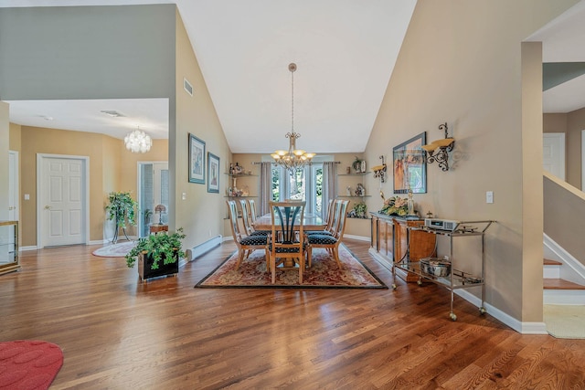 6 Ring Neck Ct, Wading River, NY 11792 - dining space featuring a chandelier, high vaulted ceiling, wood finished floors, and a baseboard heating unit