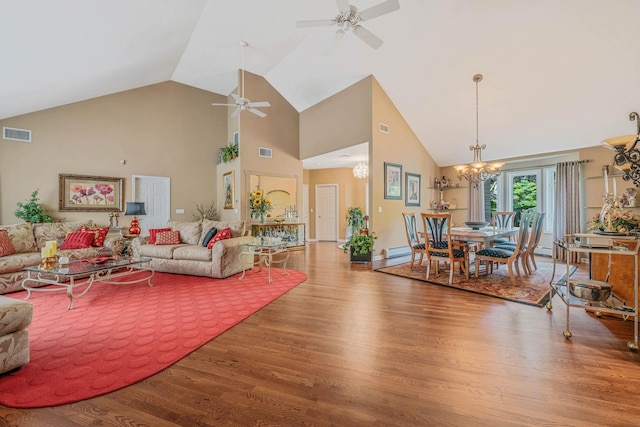 6 Ring Neck Ct, Wading River, NY 11792 - living area featuring wood finished floors, ceiling fan, high vaulted ceiling, and a chandelier