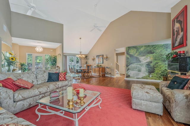 6 Ring Neck Ct, Wading River, NY 11792 - living room featuring high vaulted ceiling, a ceiling fan, wood finished floors, and a chandelier