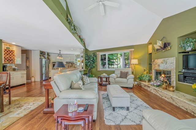 6 Ring Neck Ct, Wading River, NY 11792 - living room with a premium fireplace, vaulted ceiling, wood finished floors, and ceiling fan