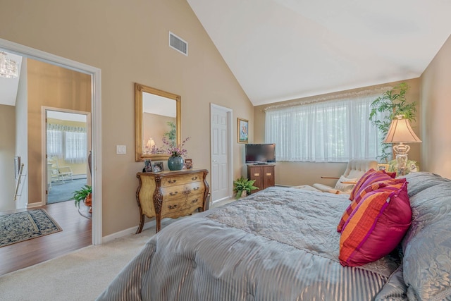 6 Ring Neck Ct, Wading River, NY 11792 - carpeted bedroom featuring high vaulted ceiling and baseboards