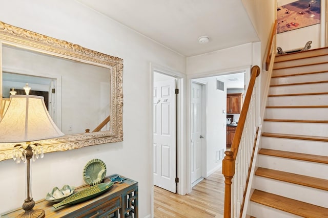 26405 Main Rd, Cutchogue, NY 11935 - staircase featuring wood finished floors