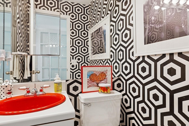 26405 Main Rd, Cutchogue, NY 11935 - bathroom with vanity and wallpapered walls