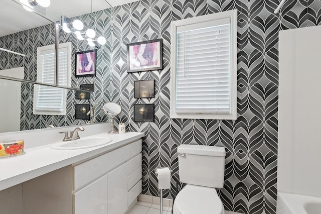 26405 Main Rd, Cutchogue, NY 11935 - full bath featuring wallpapered walls, plenty of natural light, vanity, and tile patterned flooring