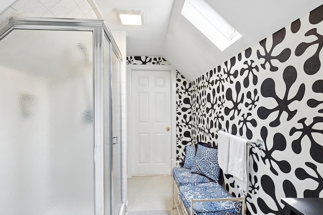 26405 Main Rd, Cutchogue, NY 11935 - full bathroom with wallpapered walls, a skylight, a shower stall, and vaulted ceiling