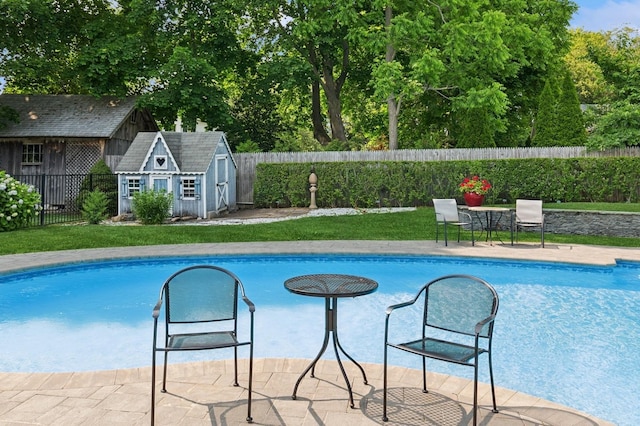 26405 Main Rd, Cutchogue, NY 11935 - view of swimming pool with a fenced backyard and an outbuilding