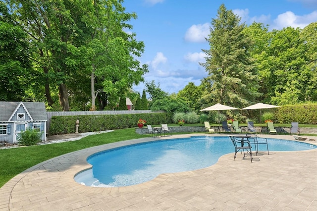 26405 Main Rd, Cutchogue, NY 11935 - view of pool featuring a patio, an outdoor structure, and a fenced backyard