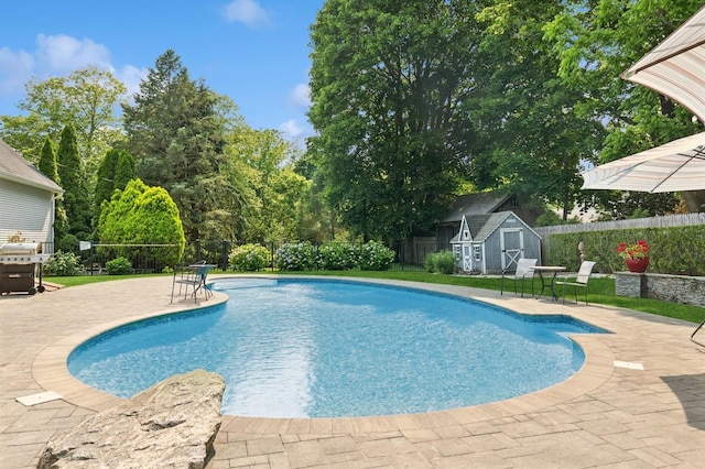 26405 Main Rd, Cutchogue, NY 11935 - view of pool with a patio, a storage shed, and a fenced backyard