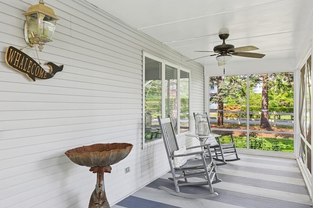 26405 Main Rd, Cutchogue, NY 11935 - sunroom with a ceiling fan and wood walls