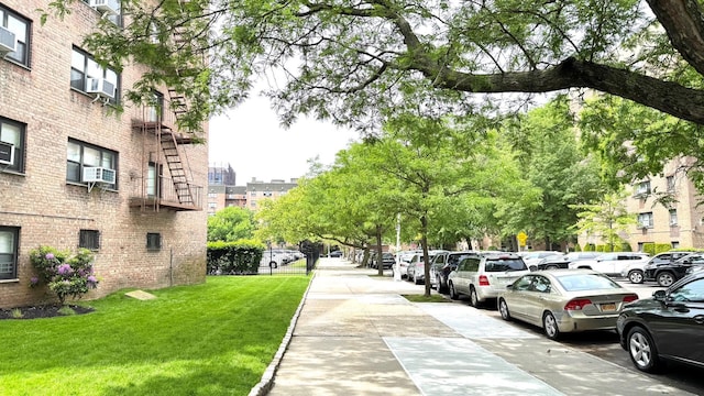 31-50 140th St Unit 1L, Flushing, NY 11354 - surrounding community featuring a lawn