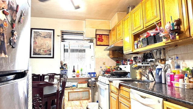 31-50 140th St Unit 1L, Flushing, NY 11354 - kitchen with white appliances, under cabinet range hood, tasteful backsplash, and dark stone countertops