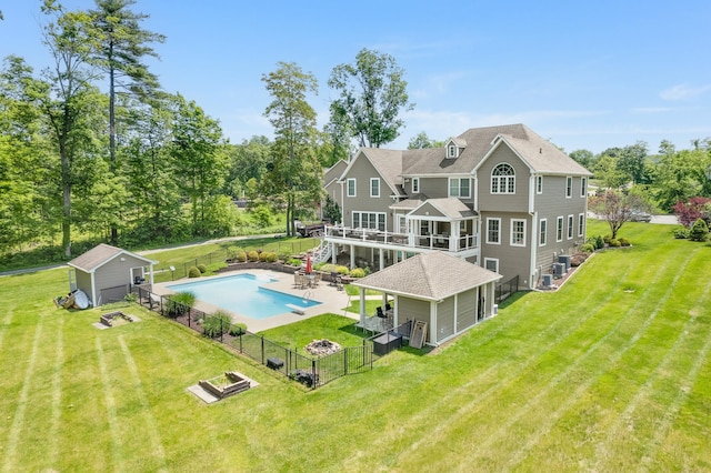 226 Windsor Rd, Fishkill, NY 12524 - back of property featuring a fenced backyard, a patio area, a wooden deck, stairway, and a storage shed