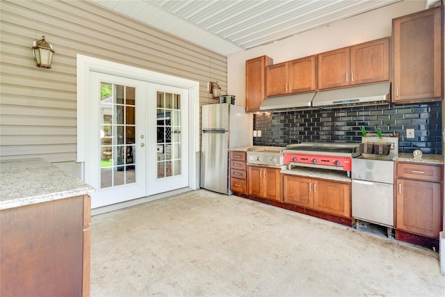 226 Windsor Rd, Fishkill, NY 12524 - kitchen featuring freestanding refrigerator, french doors, backsplash, brown cabinets, and light stone counters