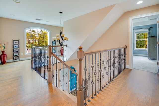226 Windsor Rd, Fishkill, NY 12524 - corridor with a chandelier, wood finished floors, an upstairs landing, and recessed lighting