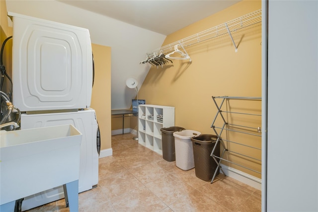 226 Windsor Rd, Fishkill, NY 12524 - laundry room with stacked washing machine and dryer and light tile patterned floors